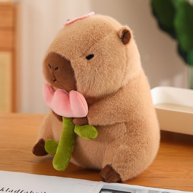 Capybara Holding a Pink Flower Plush โ photo 2